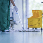 custodian cleaning epoxy floor in hospital
